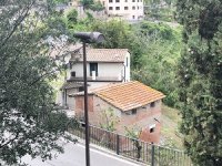 Cottage rear from parking garage top level.JPG